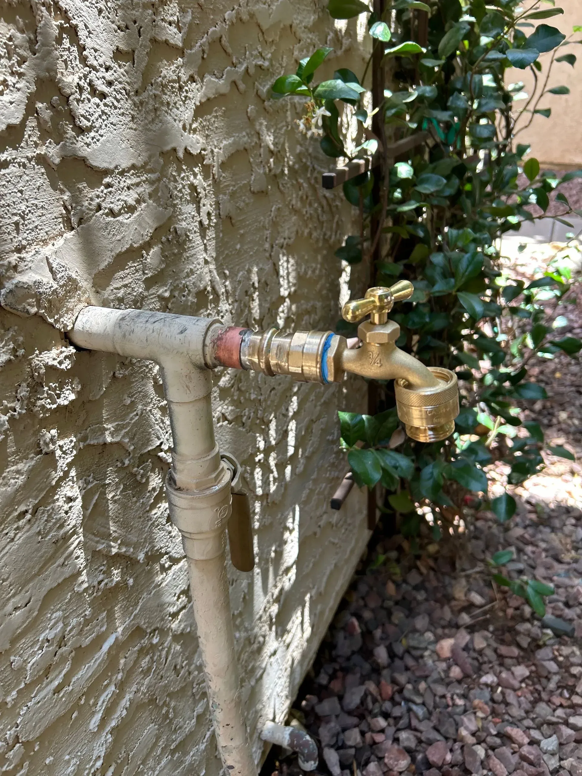Exterior water line and brass hose bib installed by KCM Mechanical in Scottsdale