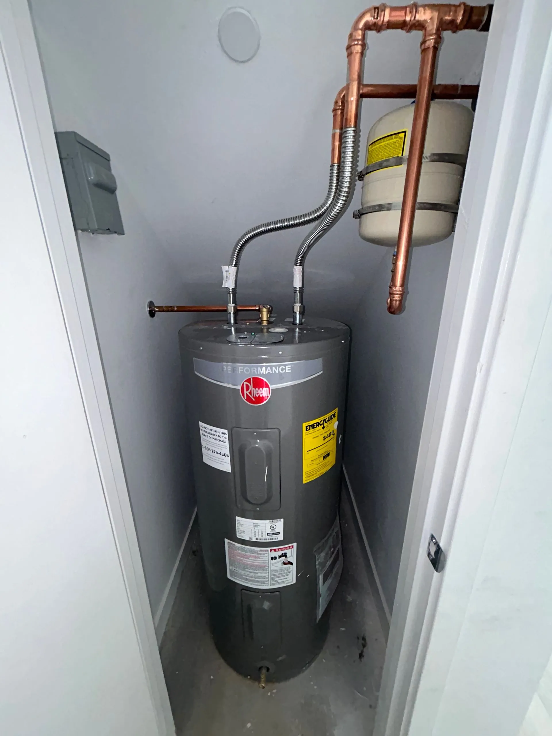 New Rheem water heater installed with copper lines and expansion tank by KCM Mechanical